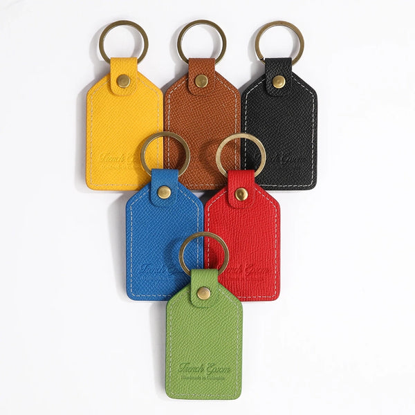 The OpusX Society Red Leather Keychain with all other colors on display back