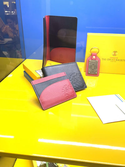The OpusX Society Red and Black Passport Holder