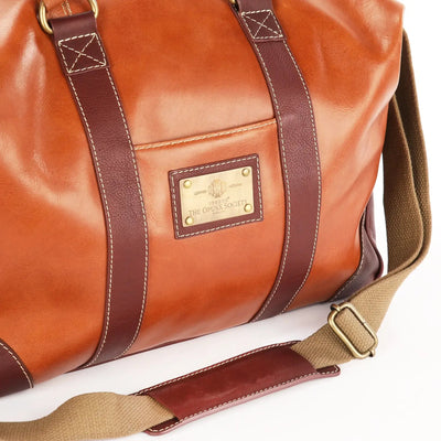 The OpusX Society Italian Leather Duffle Bag Camel and Burgundy Logo Plate