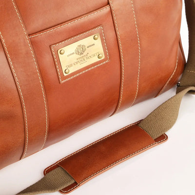 The OpusX Society Italian Leather Duffle Bag Camel Side Logo Plate