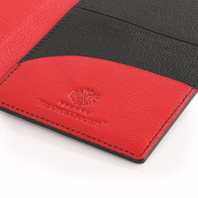 The OpusX Society Red and Black Passport Holder Inside Closeup